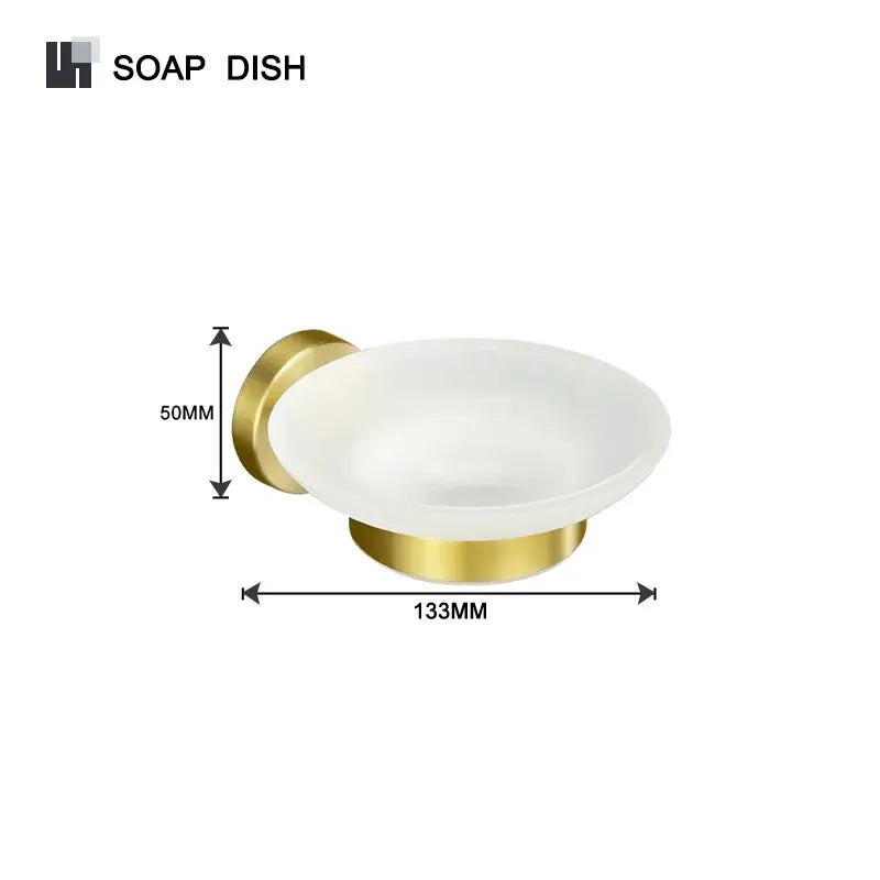 Gold-finished wall-mounted soap dish with frosted glass bowl in a modern brushed gold bathroom accessories set