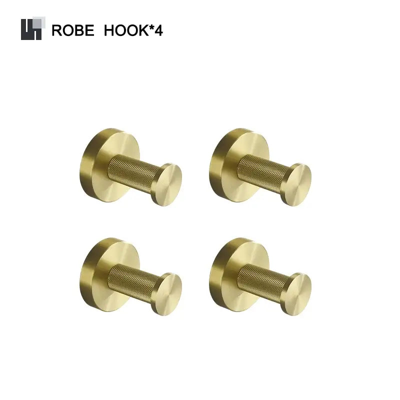 Set of four brass robe hooks with textured cylindrical design and polished brushed gold finish in bathroom accessories set