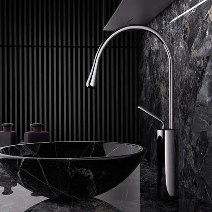 Modern chrome-finished kitchen sink faucet with sleek curved spout and minimalist design in brushed gold brass style
