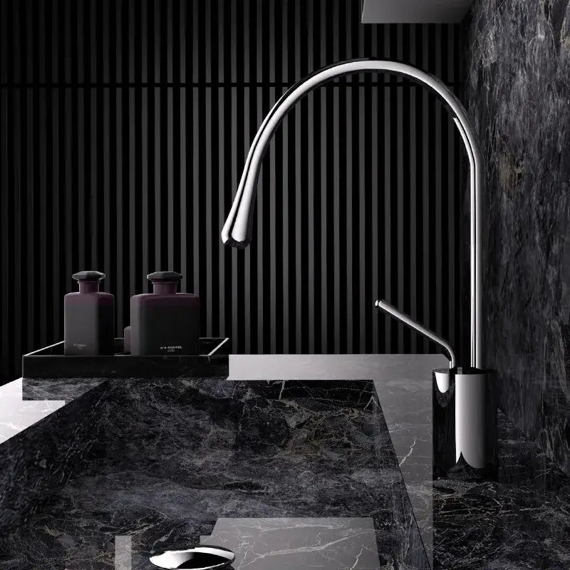 Modern brushed gold brass kitchen faucet with sleek curved spout and minimalist chrome-finished design