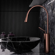 Modern brushed gold brass kitchen sink faucet with copper finish sleek curved spout and cylindrical base