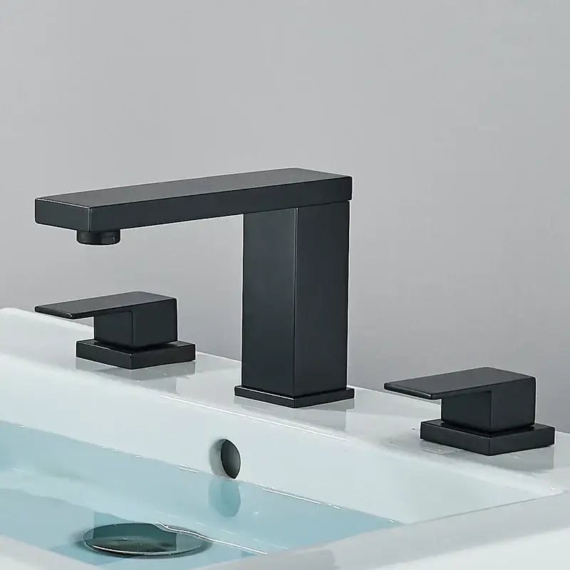 Modern brushed gold dual handle waterfall faucet with black matte rectangular spout and square handles by decorbites