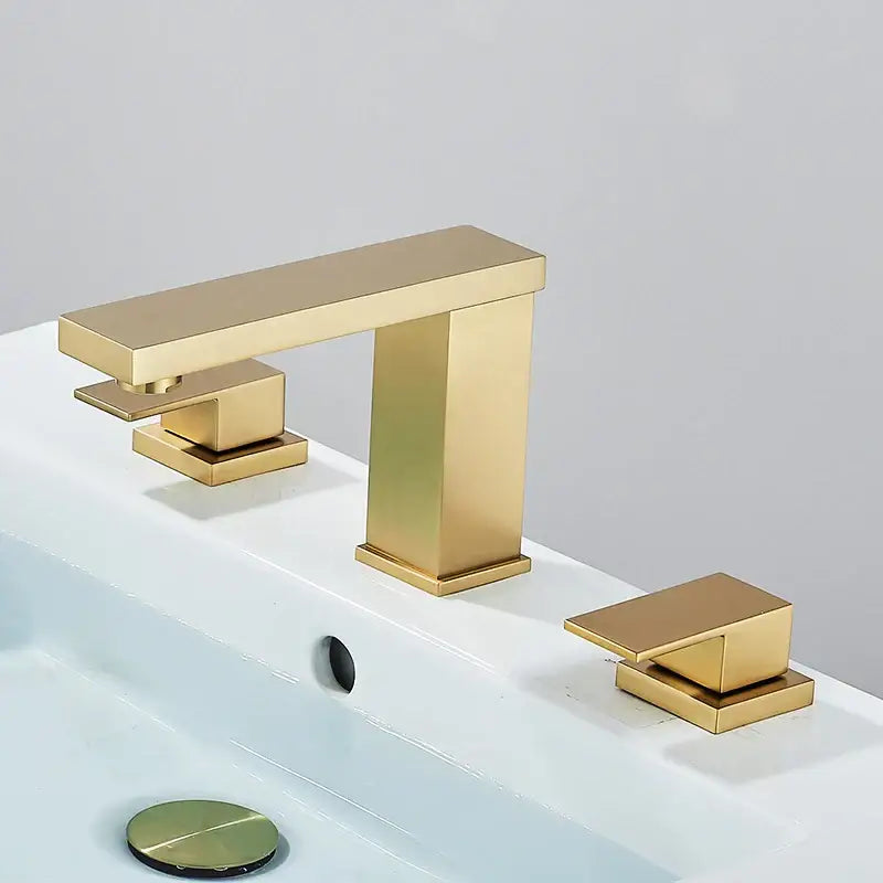 Modern brushed gold dual handle bathroom faucet with sleek rectangular spout and square handles decorbites brushed gold design
