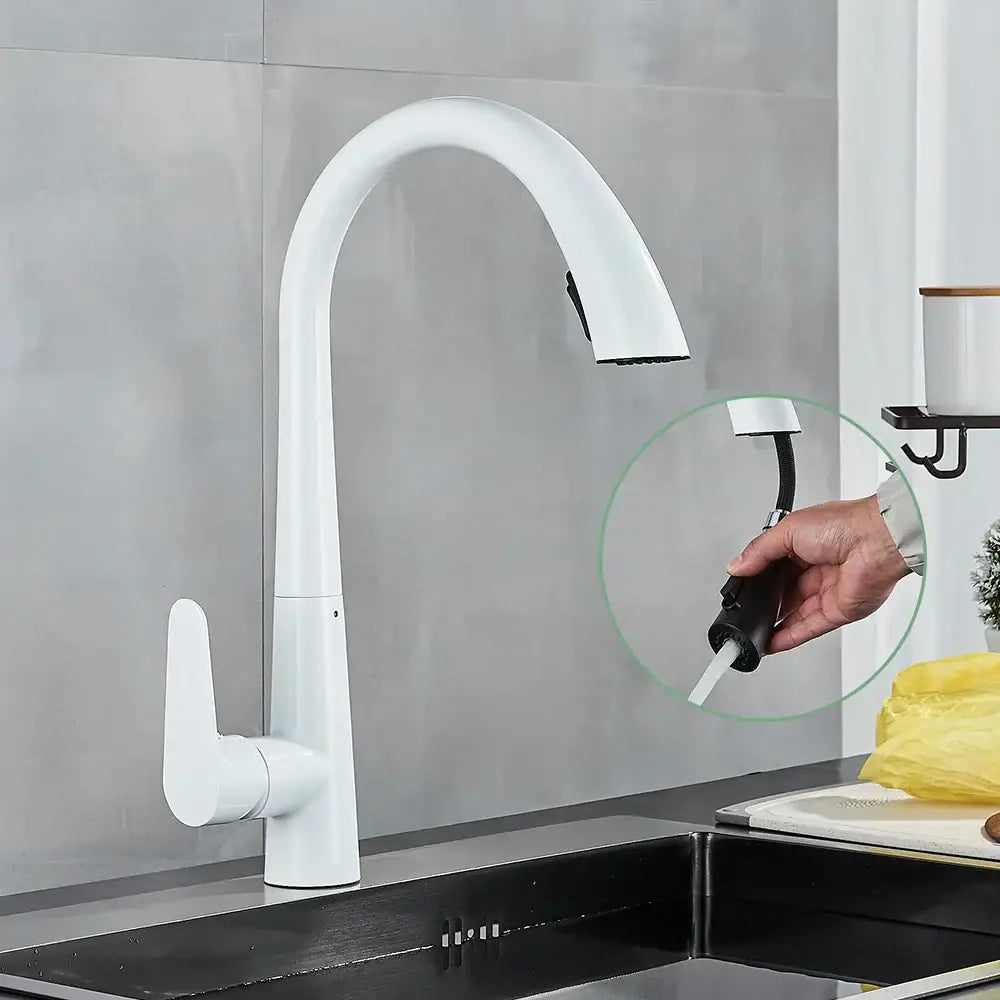 Modern brushed gold gourmet kitchen faucet with white curved spout and flexible pull out spray head by decorbites