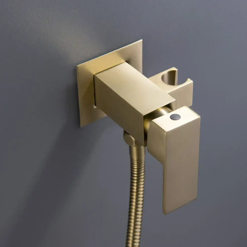 Modern brushed gold hand bidet sprayer kit with sleek rectangular faucet and integrated hose for bathroom use