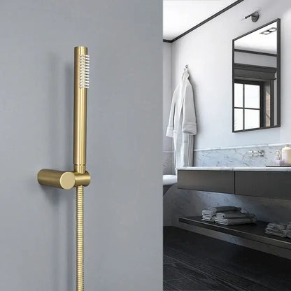 Modern brushed gold hand shower with stainless steel hose featuring a sleek design for bathroom use