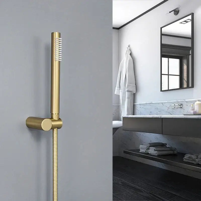 Modern brushed gold hand shower with stainless steel hose featuring a sleek design for bathroom use