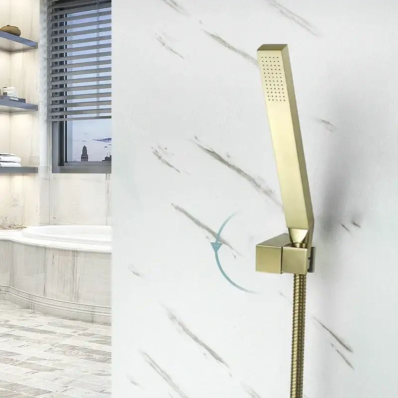 Modern brushed gold hand shower with stainless steel hose featuring a gold rectangular showerhead with metallic finish