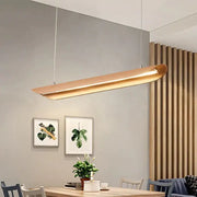A sleek modern pendant kitchen island light with brushed gold finish and minimalist design for chandeliers kitchen island