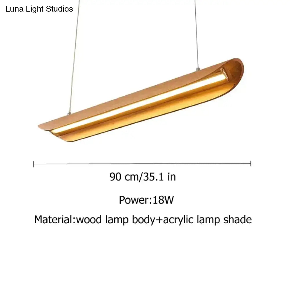 A sleek golden kitchen island light with wooden body and acrylic shade ideal for wood chandeliers kitchen use