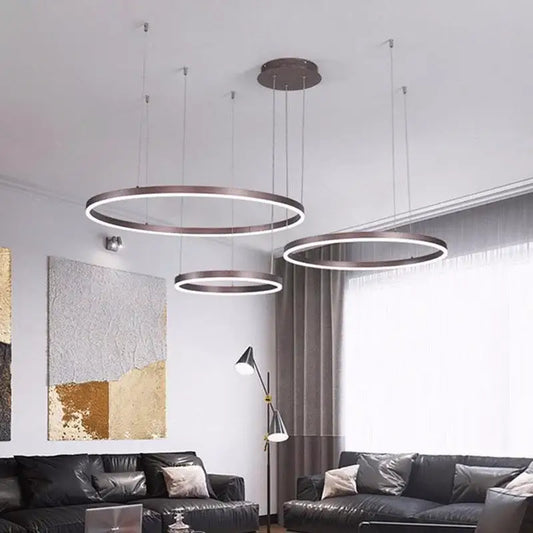 Modern brushed gold led chandelier with sleek metallic finish and illuminated rings for dining room decorbites brushed gold
