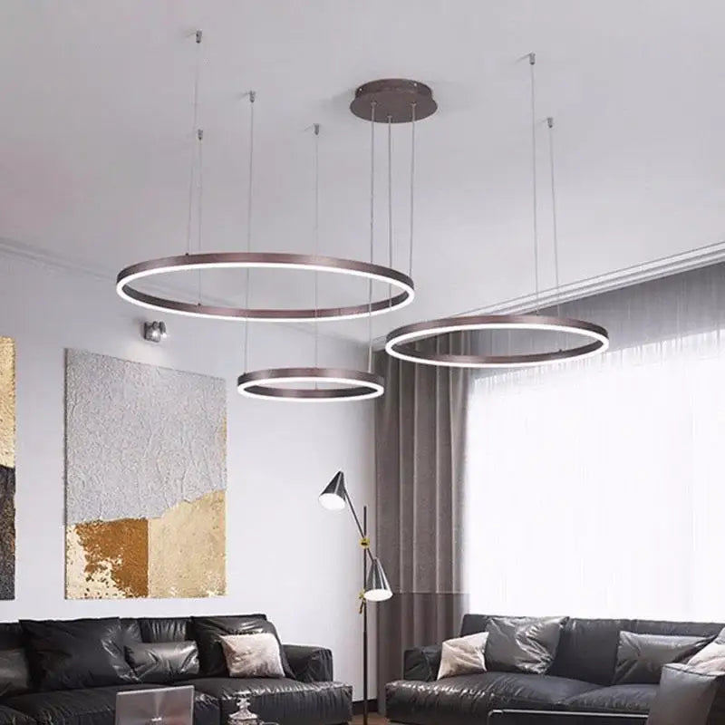 Modern brushed gold led chandelier with sleek metallic finish and illuminated rings for dining room decorbites brushed gold