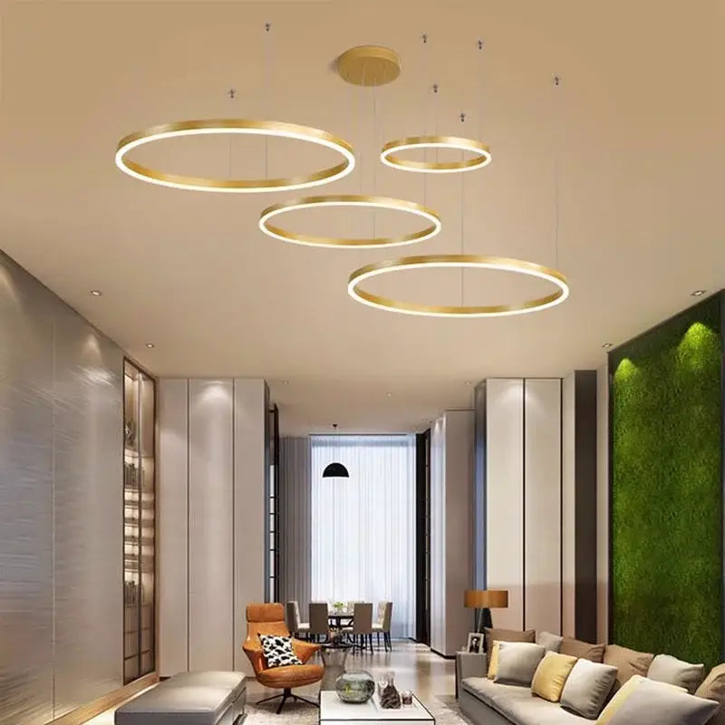 Modern brushed gold led chandelier featuring circular pendant lights with sleek minimalist design for dining room decorbites brushed gold