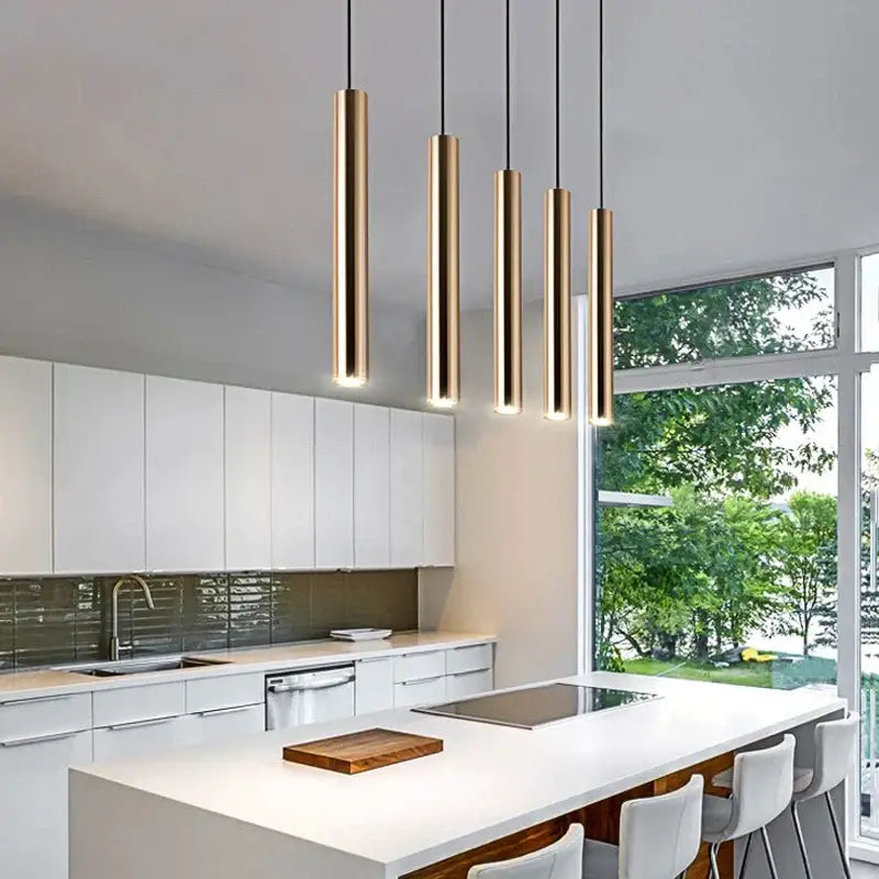 Five sleek cylindrical pendant lights with a brushed gold finish for modern dining room decorbites gold led pendant light