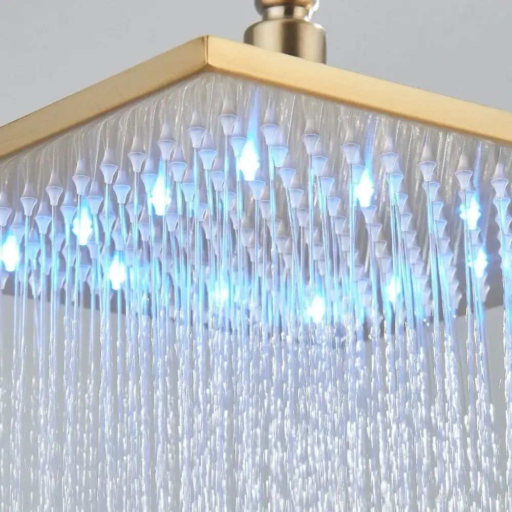 Modern brushed gold shower head with led lights and multiple spray patterns emitting cascading water droplets