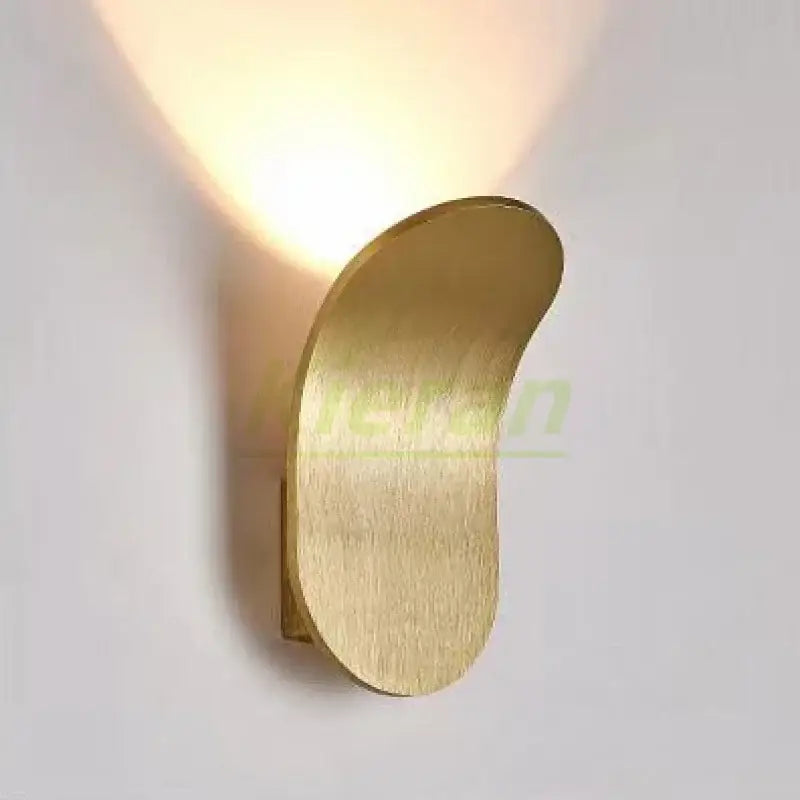 Modern brushed gold led wall lamp with curved design in gold-finished brushed metal for living room use