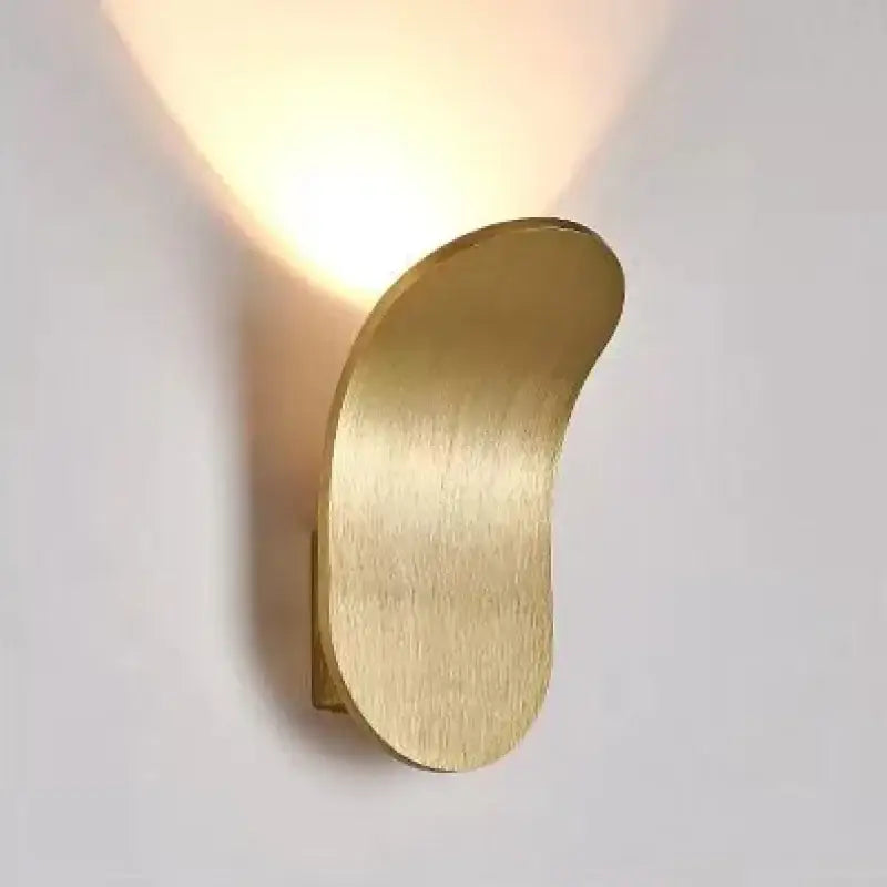 Sleek modern brushed gold led wall lamp with curved design for living room use and stylish lighting solution
