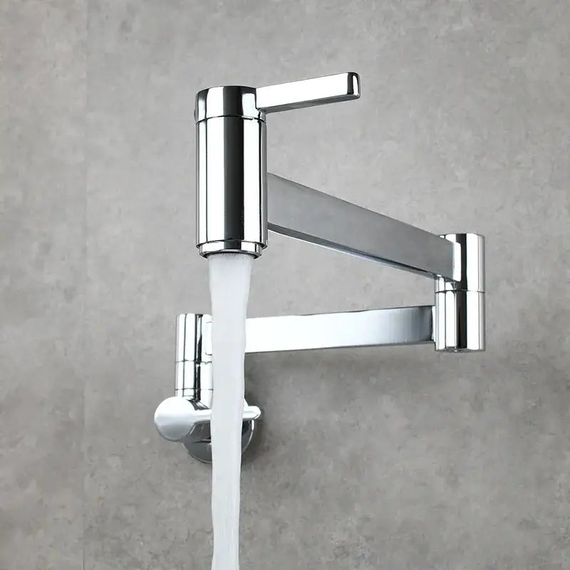 Chrome-finished articulated pot filler faucet with a sleek modern design and white water stream flowing from spout