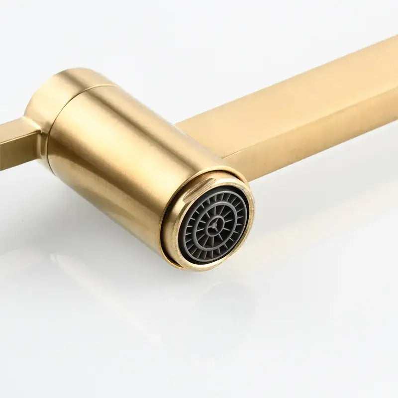 Modern brushed gold pot filler faucet with a rectangular foldable spout and black plastic spray nozzle wall mounted