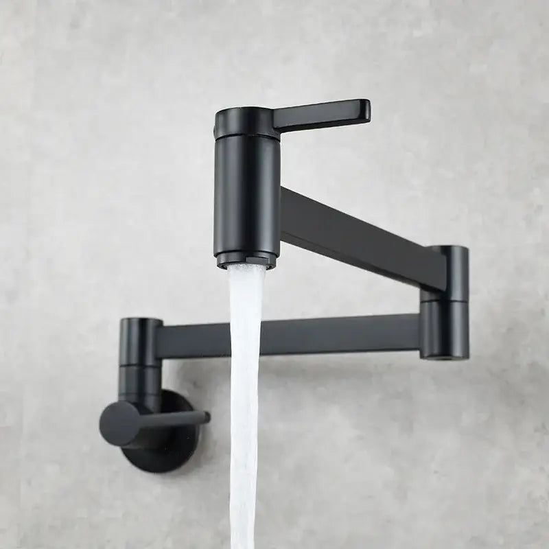 Black matte wall-mounted pot filler faucet with sleek articulated arm and dual handles for modern kitchen use