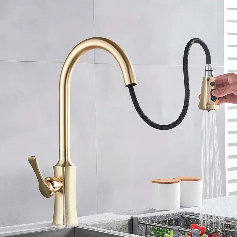 Modern brushed gold pull out kitchen faucet with sleek curved spout and extendable black hose decorbites brushed gold