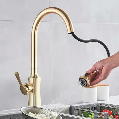 Modern brushed gold kitchen faucet with a sleek curved spout and extendable pull out spray head by decorbites brushed gold