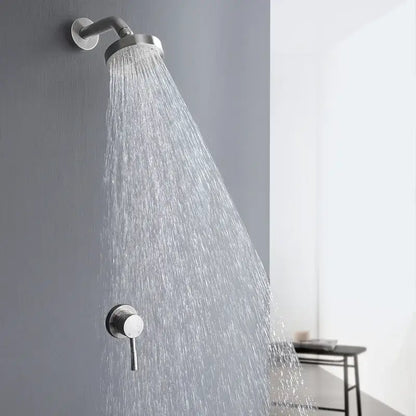 Modern chrome-finished rainfall showerhead with sleek design mounted on wall in brushed gold shower faucet set