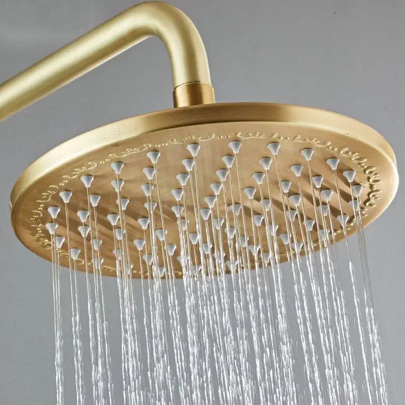 Modern brushed gold shower set with round ornate showerhead featuring multiple water jets by decorbites brushed gold