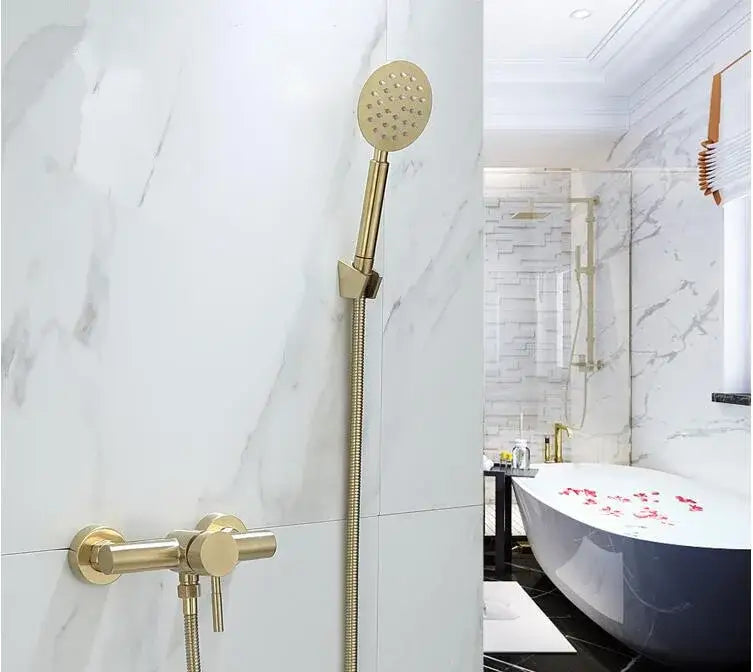 Modern brushed gold shower faucet set featuring a gold-tone handheld mixer with perforated face and brass hose