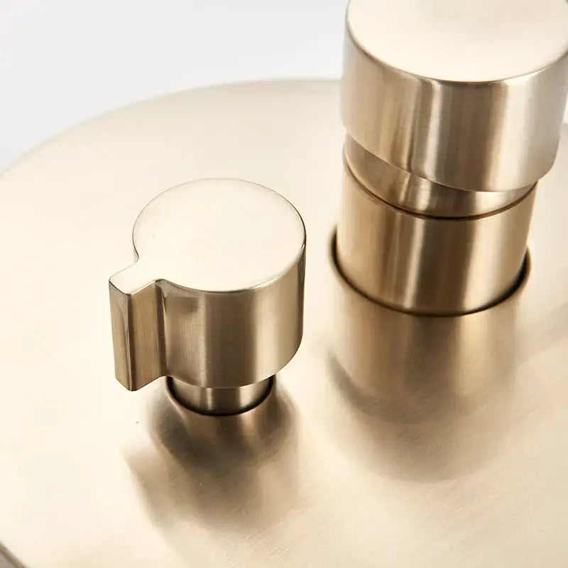 Modern brushed gold shower mixer control valve with brushed nickel faucet handles and minimalist design