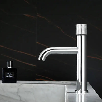 Modern brushed gold single handle basin faucet with chrome finish and textured knurled handle for bathroom use