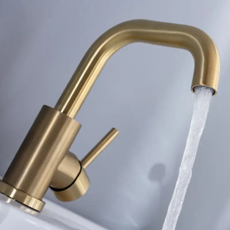 Modern brushed gold basin faucet with single handle and sleek curved spout for bathroom mixer tap use