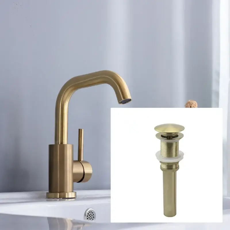 Modern brushed gold single handle basin faucet with brass finish, sleek curved spout, and matching drain assembly for bathroom use