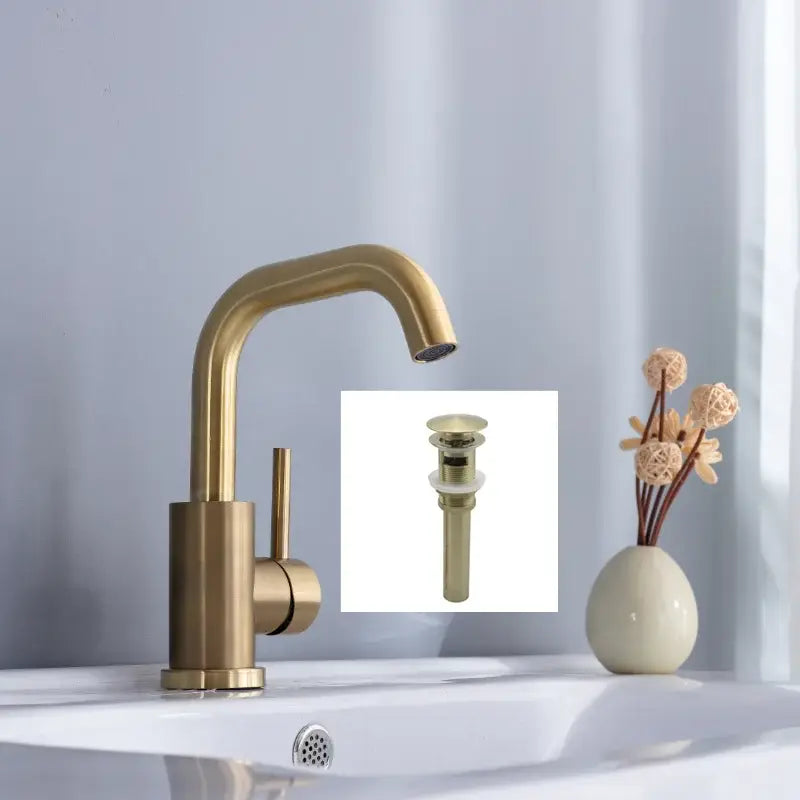 Modern brushed gold basin faucet with brass finish single handle and sleek curved spout for bathroom use