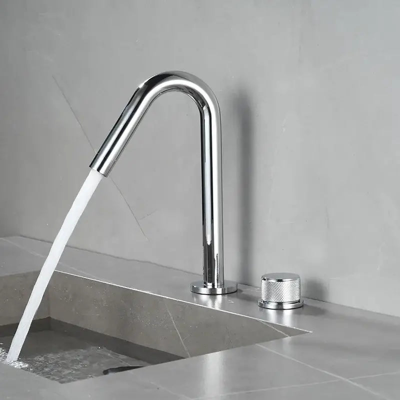 Modern brushed gold single handle bathroom basin faucet with chrome finish, sleek curved spout, and premium ceramic valve