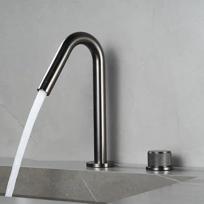 Modern brushed gold single handle bathroom basin faucet with matte black curved spout and premium ceramic valve