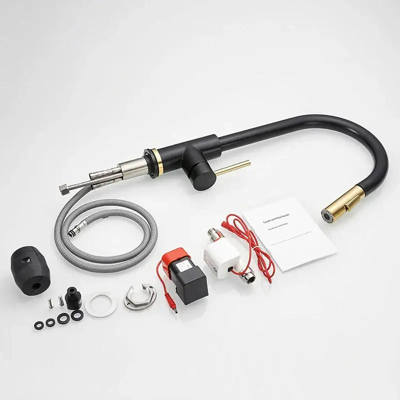 Modern brushed gold smart sensor kitchen faucet with black and brass curved spout and stainless steel handle accents