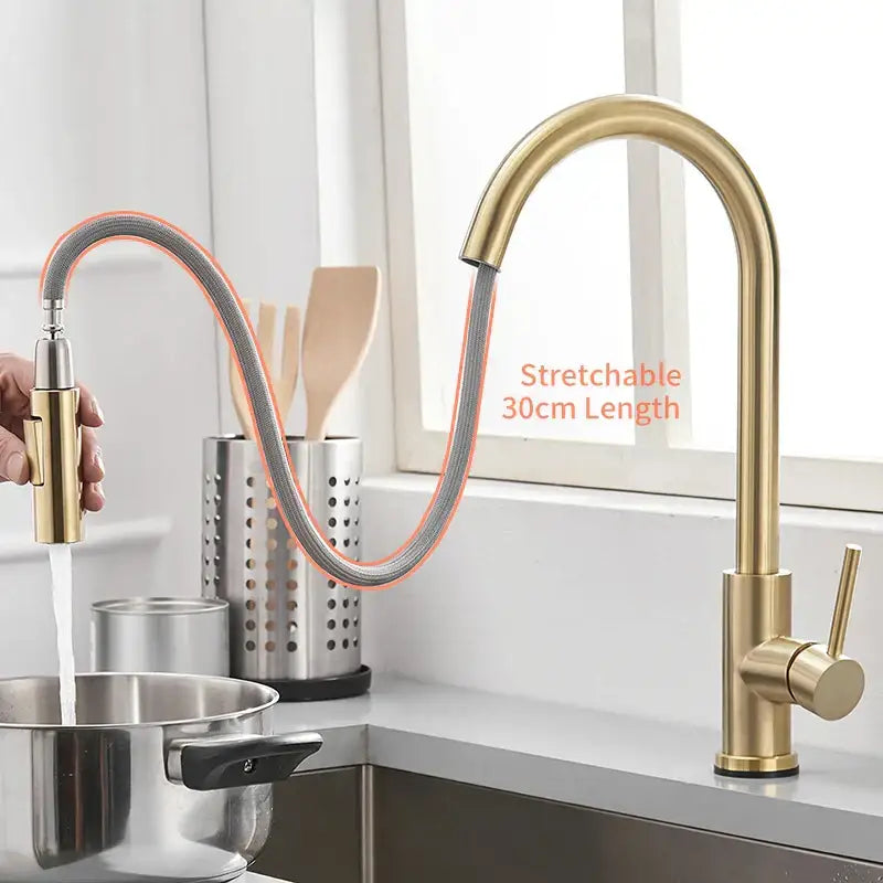 Modern brushed gold smart sensor kitchen faucet with dual outlet and flexible pull-down spray head in gold tone