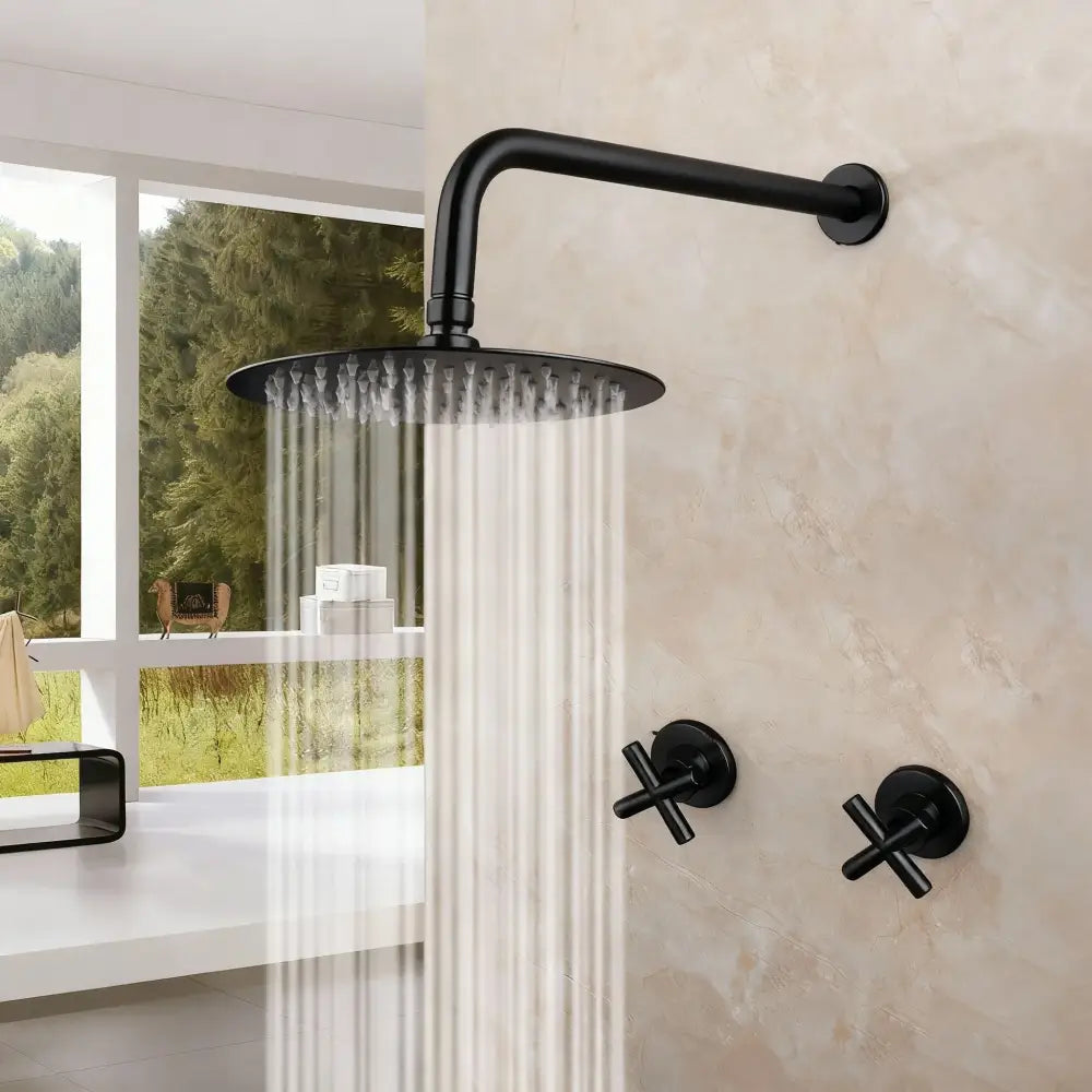 Black matte-finish rain shower head with cross-shaped wall-mounted controls in modern brushed gold rainfall shower set