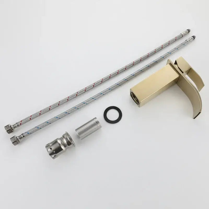 Modern brushed gold stainless steel basin faucet with sleek minimalist design and curved waterfall spout for bathroom use