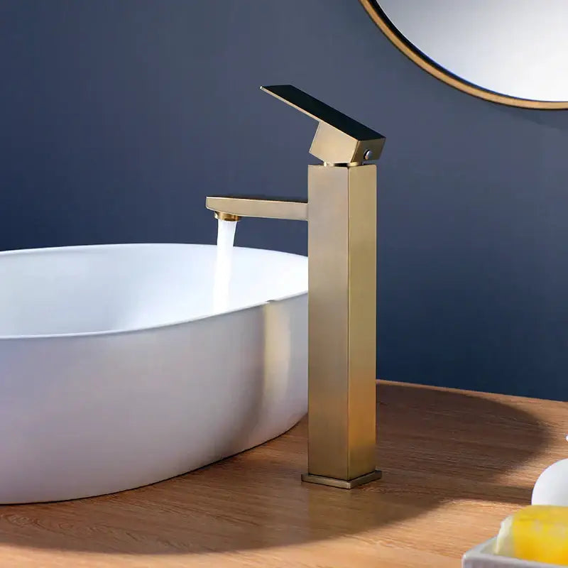 Modern brushed gold stainless steel basin mixer faucet with sleek rectangular design and black ceramic handle by decorbites