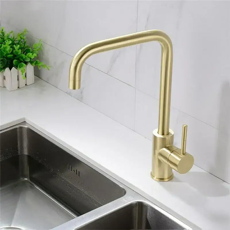 Modern brushed gold stainless steel kitchen faucet with a sleek curved spout and cylindrical handle for kitchen use