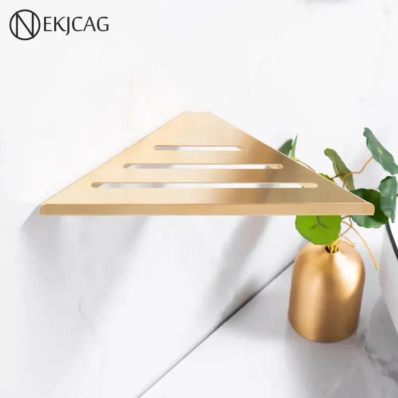 Modern brushed gold stainless steel triangular shower storage rack with horizontal slats and sleek metallic finish