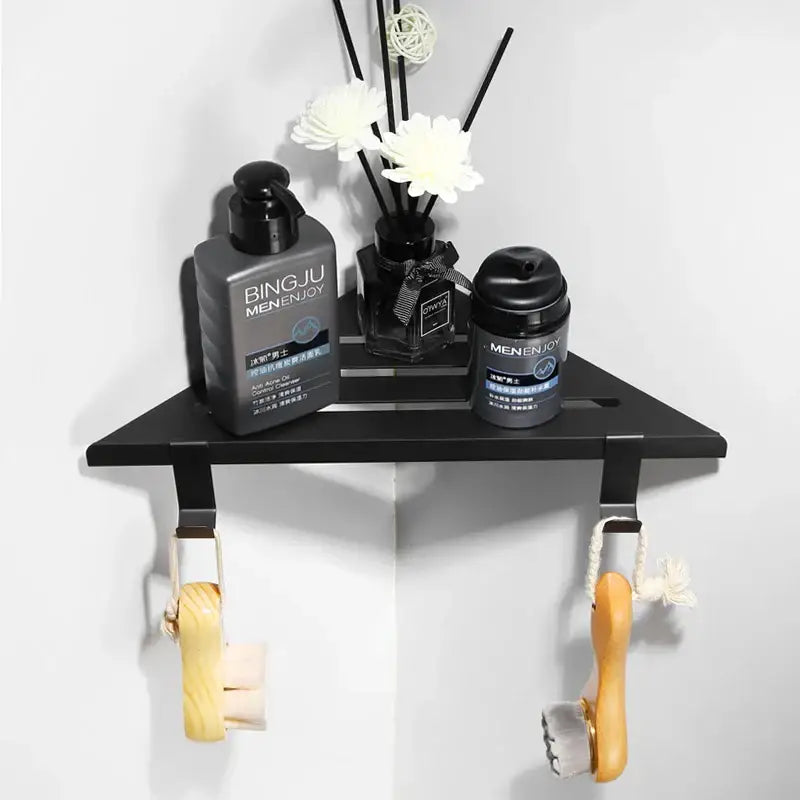 Modern brushed gold stainless steel triangle rack shower storage wall-mounted with hooks holding wooden brushes