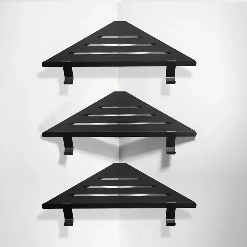Black triangular shower caddy with slatted design and matte finish for brushed gold stainless steel shower storage