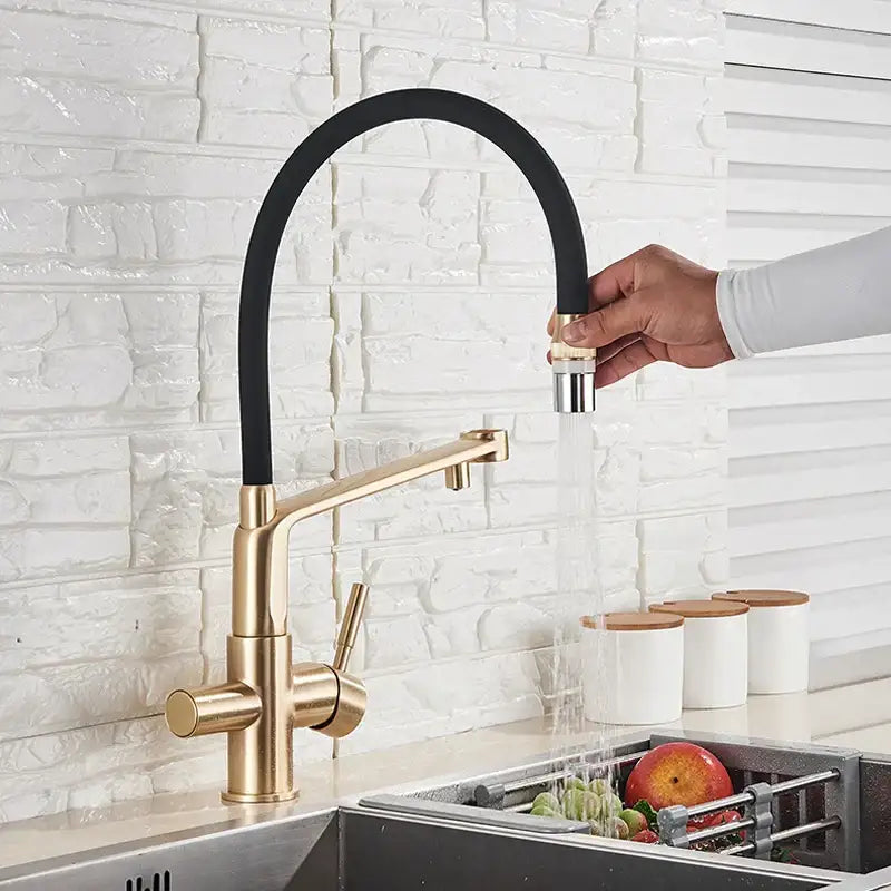 Modern brushed gold swivel kitchen faucet with black rubber hose and pull-out spray head for kitchen use