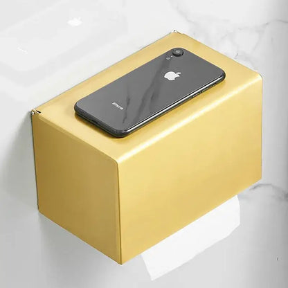 Modern brushed gold rectangular paper holder with a sleek minimalist design for toilet paper in bathroom use