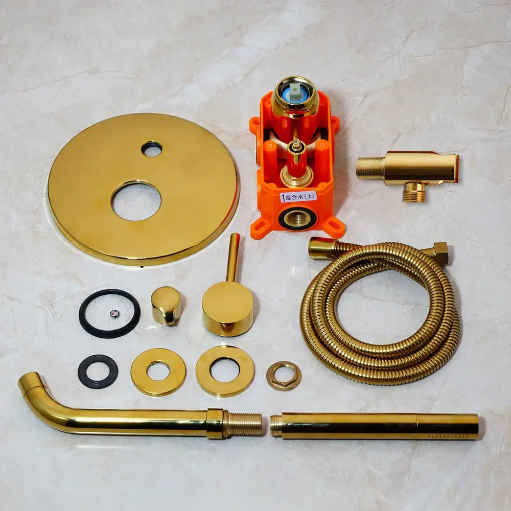 Modern brushed gold tub faucet shower tub faucet assembly in gold-finished brass with orange plastic housing and coiled hose
