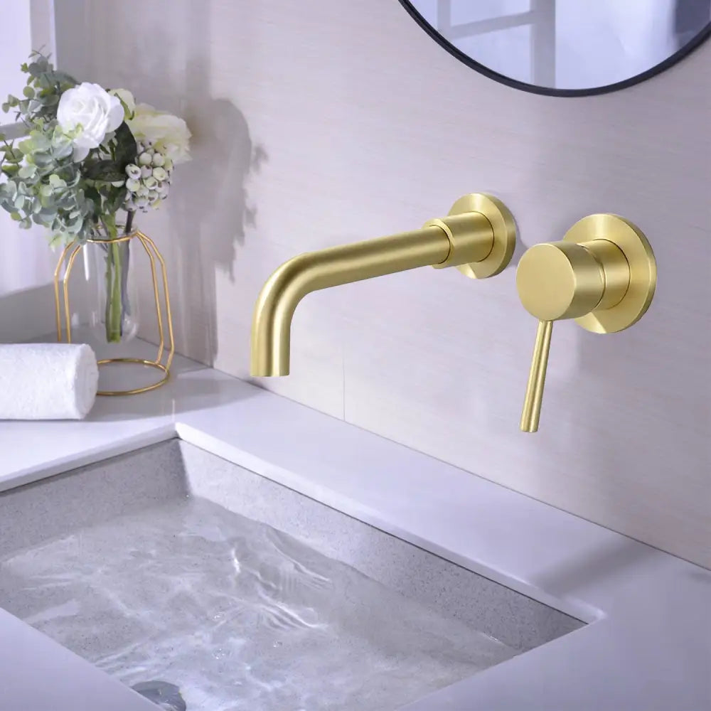 Modern brushed gold wall mount bathroom faucet with a sleek minimalist brass design and a single lever handle.