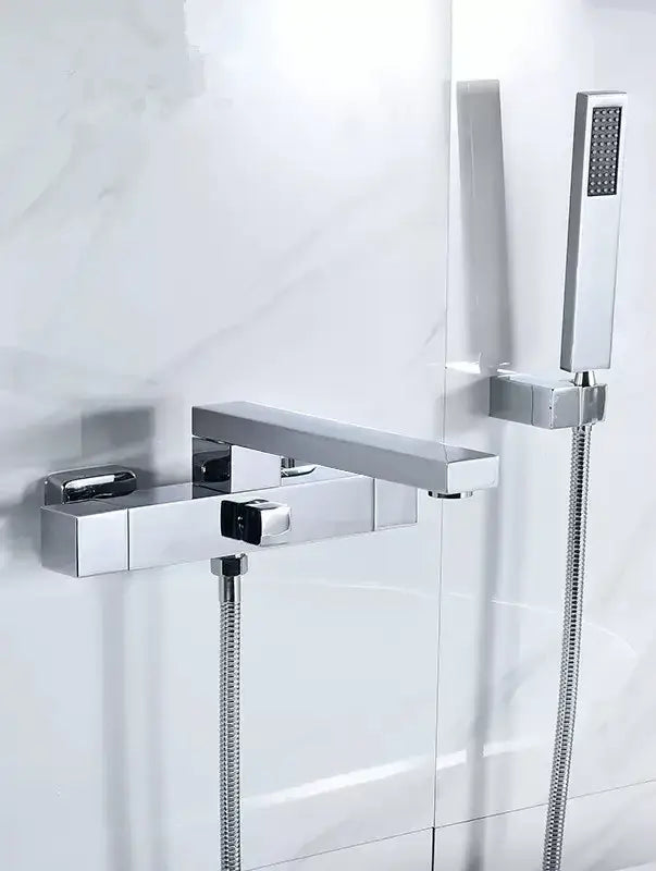 Modern brushed gold wall mounted waterfall bathtub set with a chrome finish faucet and matching handheld showerhead decorbites brushed gold